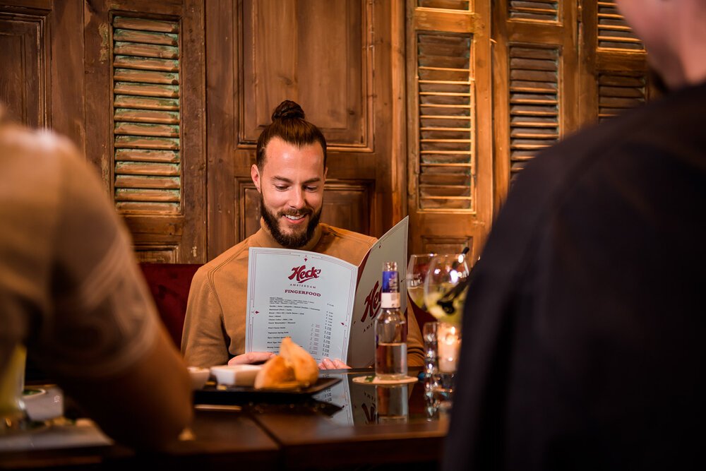 Guest reading the menu